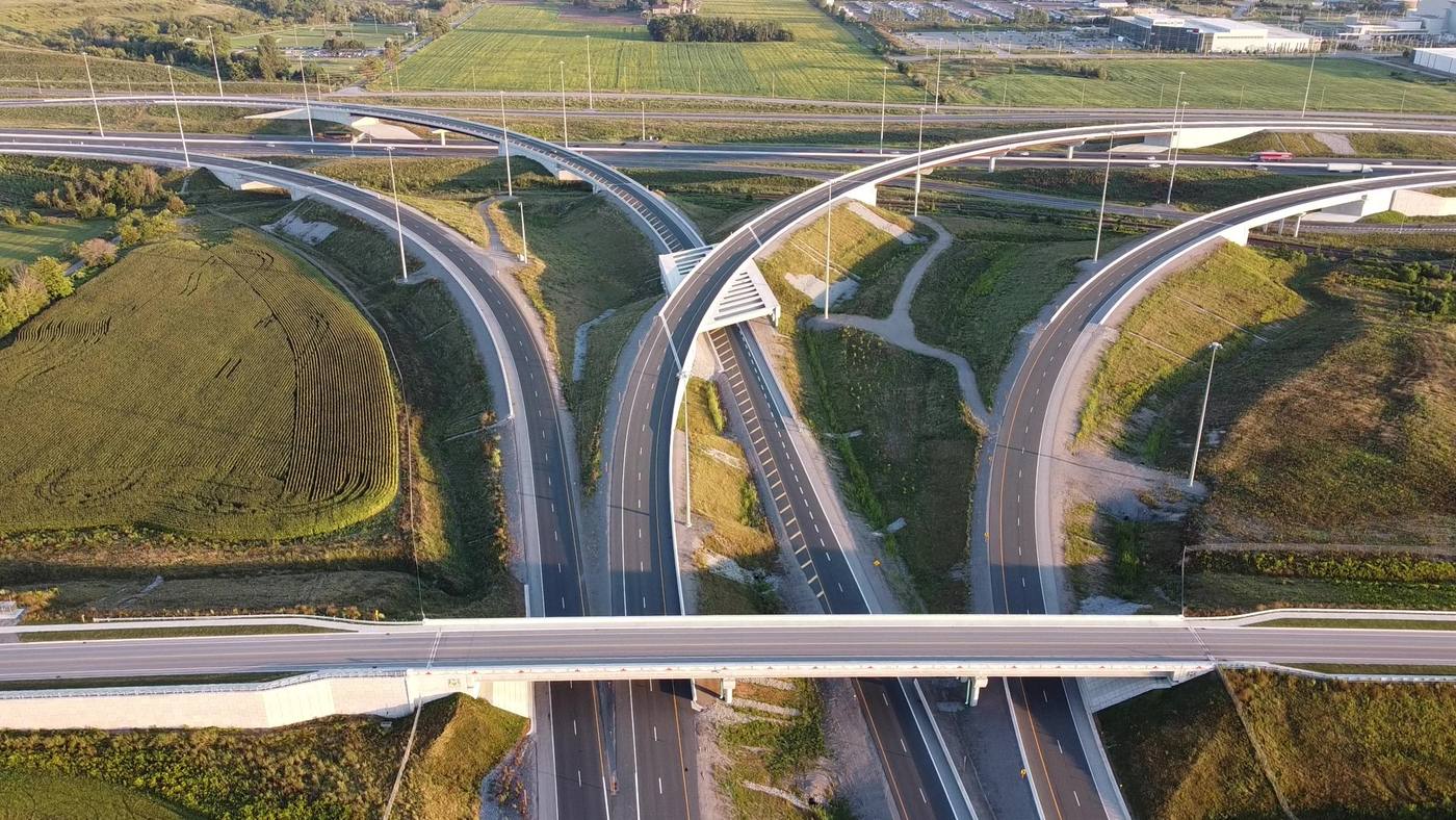 A Highway 401 interchange seen from the air, farmland on both sides